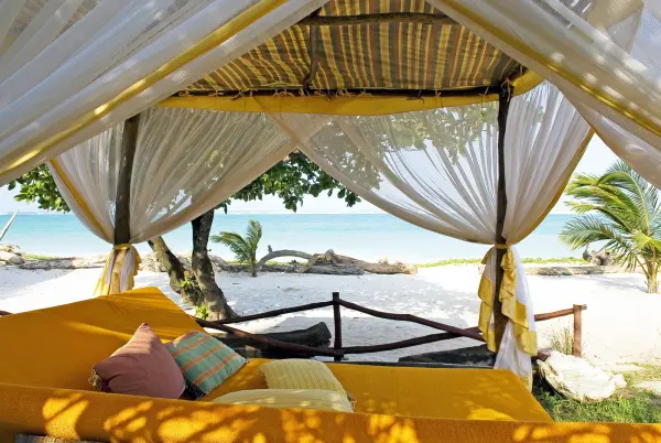 Kenya_Elewana_AfroChic_Swahili_bed_on_beach